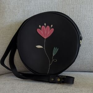 Portland Leather Black Round Crossbody with Pink Floral Appliqué 9" Diameter